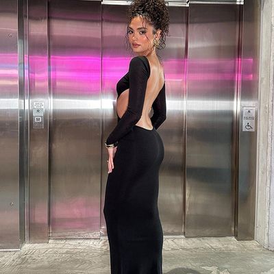 Une nouvelle chaude sexy, une robe à dos bas, une robe creuse, une longue manche, une poche à hanche, une robe de couleur.